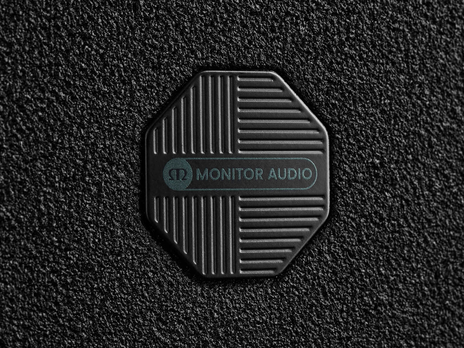 Closeup of Monitor Audio's Cinergy badge.